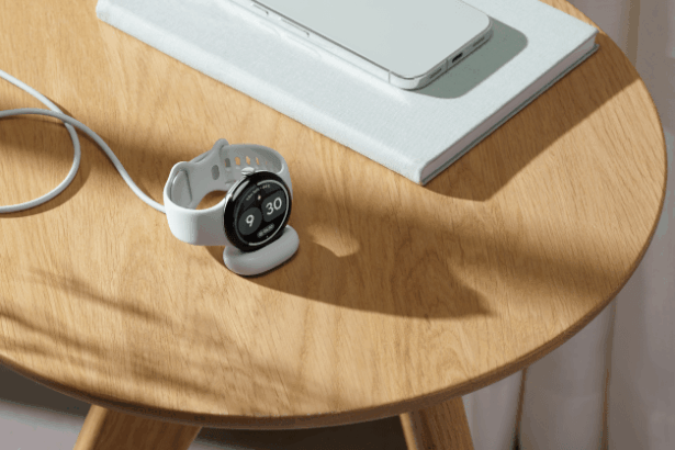 Google Pixel Watch 5 on display with health monitoring features shown on screen