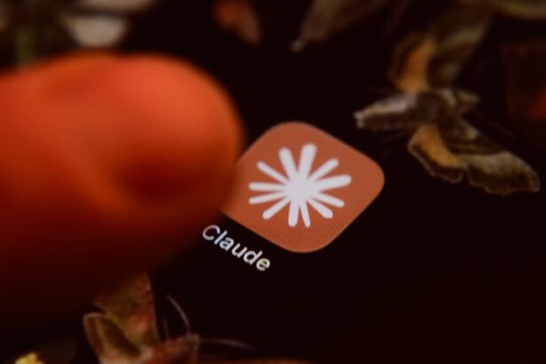 Smartphone displaying Claude AI app icon on screen