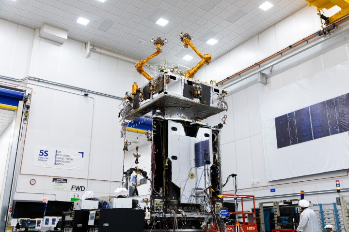 Northrop Grumman MRV robotic satellite in orbit above Earth with arms extended