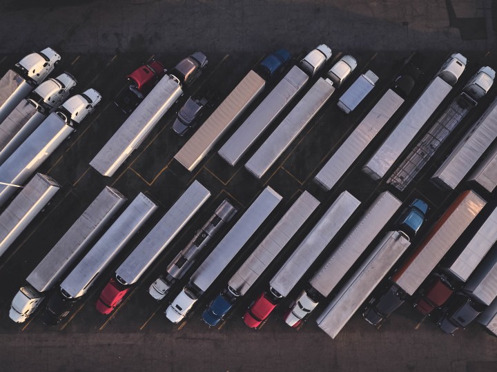Uber Freight truck on highway with digital security lock overlay