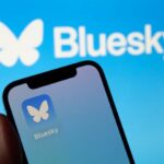 Bluesky social app icon and logo on a smartphone screen